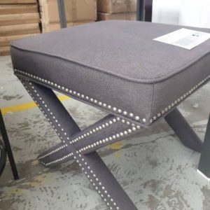 EX FURNITURE HIRE - GREY CROSS LEG FOOTSTOOL WITH STUD DETAIL SOLD AS IS