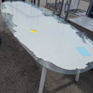 EX HIRE - LARGE OVAL GLASS TABLE SOLD AS IS
