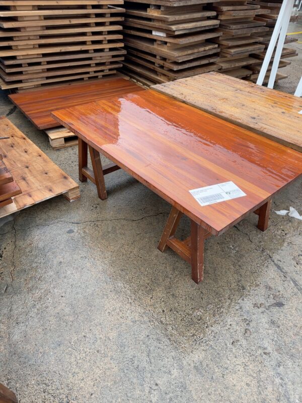 EX HIRE DARK TIMBER COFFEE TABLE WITH DARK TIMBER LEGS SOLD AS IS