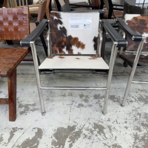 EX HIRE REPLICA LE COBUSIER LC1 COWHIDE SLING CHAIR, SOLD AS IS