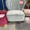 EX STAGING - GREEN VELVET CHAIR, SLIGHTLY BENT FRONT LEG, SOLD AS IS