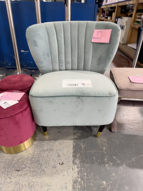 EX STAGING - GREEN VELVET CHAIR, SLIGHTLY BENT FRONT LEG, SOLD AS IS