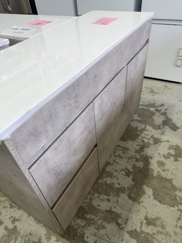 NEW LOLA 1200MM CONCRETE LOOK FLOOR VANITY, FINGER PULL LEFT HAND DRAWER, WITH FLAT WHITE STONE TOP WITH NO HOLE CA11-1200L-ST56FT