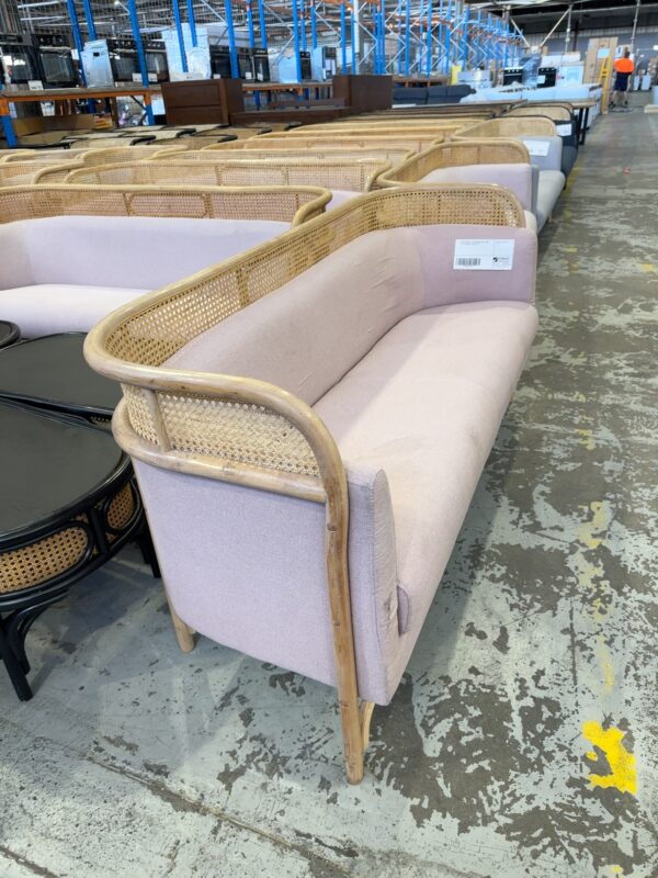 EX EVENT HIRE - RATTAN COUCH WITH LIGHT PINK UPHOLSTERY, SOLD AS IS
