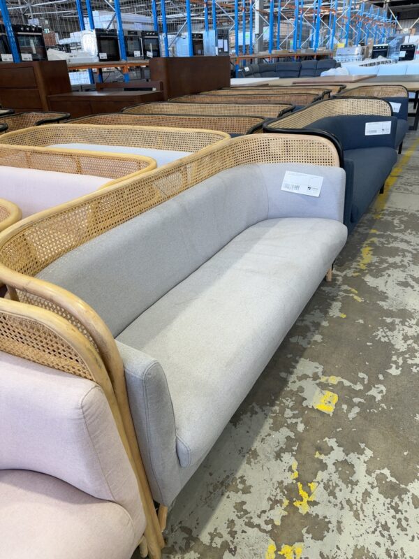 EX EVENT HIRE - RATTAN COUCH WITH LIGHT GREY UPHOLSTERY, SOLD AS IS