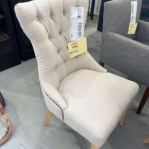 EX STAGING - BEIGE BUTTON UPHOLSTERED CHAIR WITH STUD DETAIL, SOLD AS IS