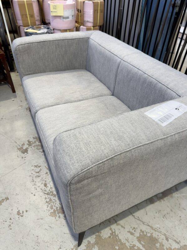 EX STAGING FURNITURE - GREY 2 SEATER COUCH, SOLD AS IS