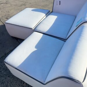 EX HIRE WHITE WITH BLACK TRIM LEFT HAND SIDE OF MODULAR COUCH, SOLD IN PARTS, SOLD AS IS