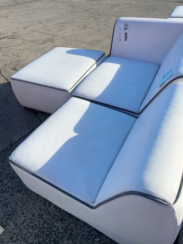 EX HIRE WHITE WITH BLACK TRIM LEFT HAND SIDE OF MODULAR COUCH, SOLD IN PARTS, SOLD AS IS
