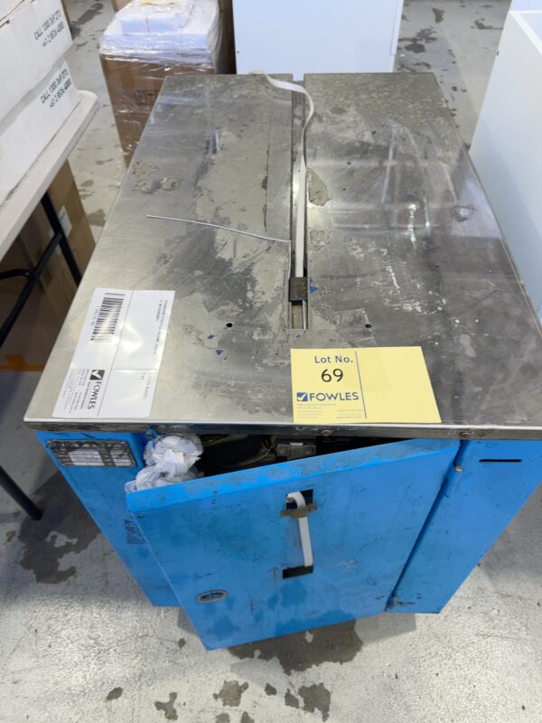 SECONDHAND STRAPPING MACHINE, SOLD AS IS, NO WARRANTY