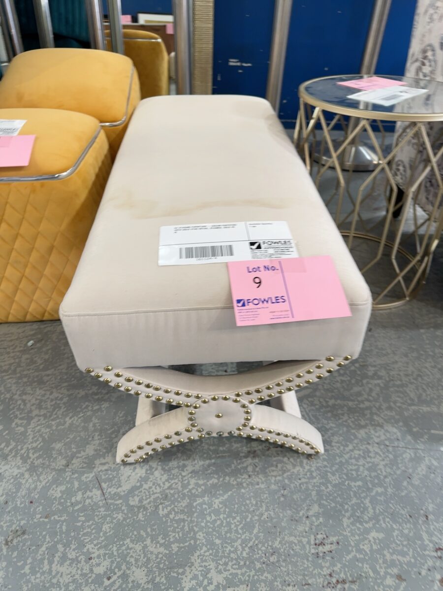 EX STAGING FURNITURE - CREAM FOOTSTOOL WITH GOLD STUD DETAIL, STAINED, SOLD AS IS