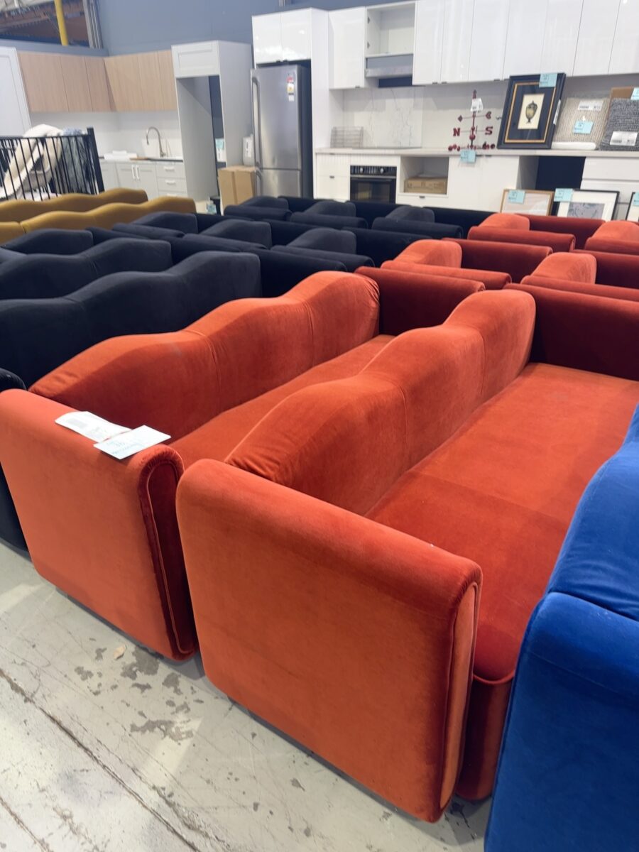 EX HIRE EVENT FURNITURE - BURNT ORANGE VELVET LOUNGE WITH CURVED TOP, SOLD AS IS