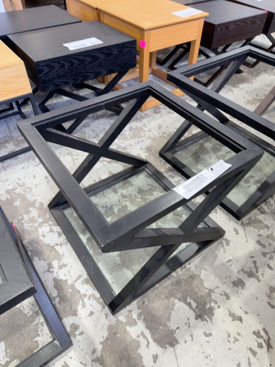 EX STAGING BLACK TIMBER CROSS LEG TABLE WITH GLASS BOTTOM SHELF, MISSING GLASS TOP, SOLD AS IS