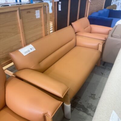 EX HIRE - TAN PU 2 SEATER COUCH WITH TIMBER FRAME, SOLD AS IS