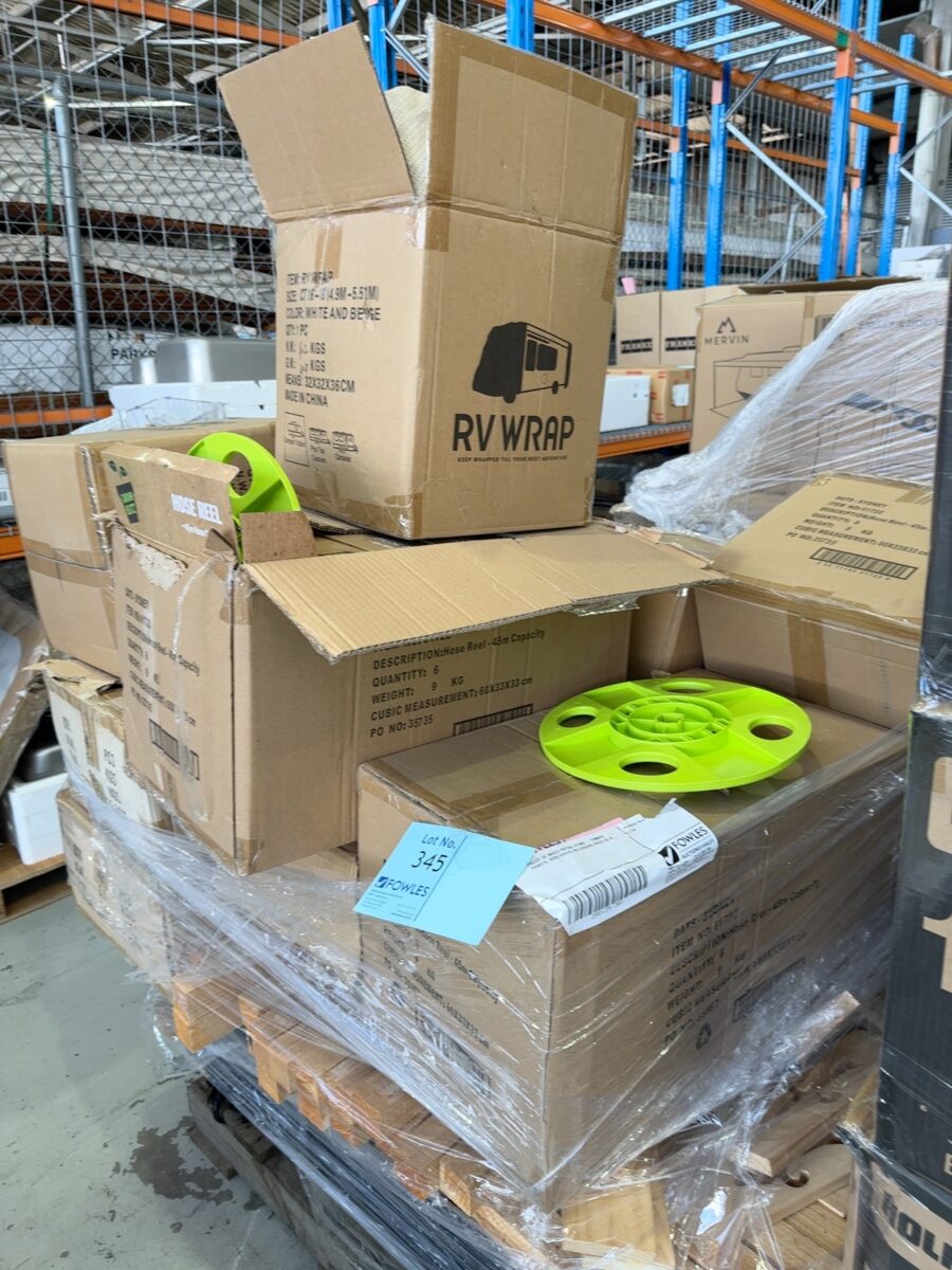 PALLET OF MIXED RETAIL ITEMS - TIMBER PICKETS, HOSE REELS, RV COVERS SOLD AS IS